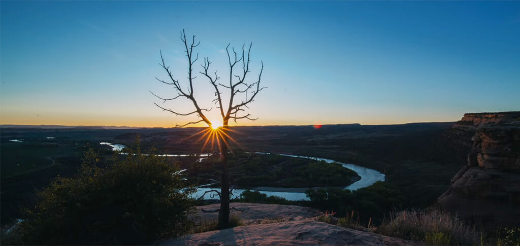 Sun emerging over Colorado River bend