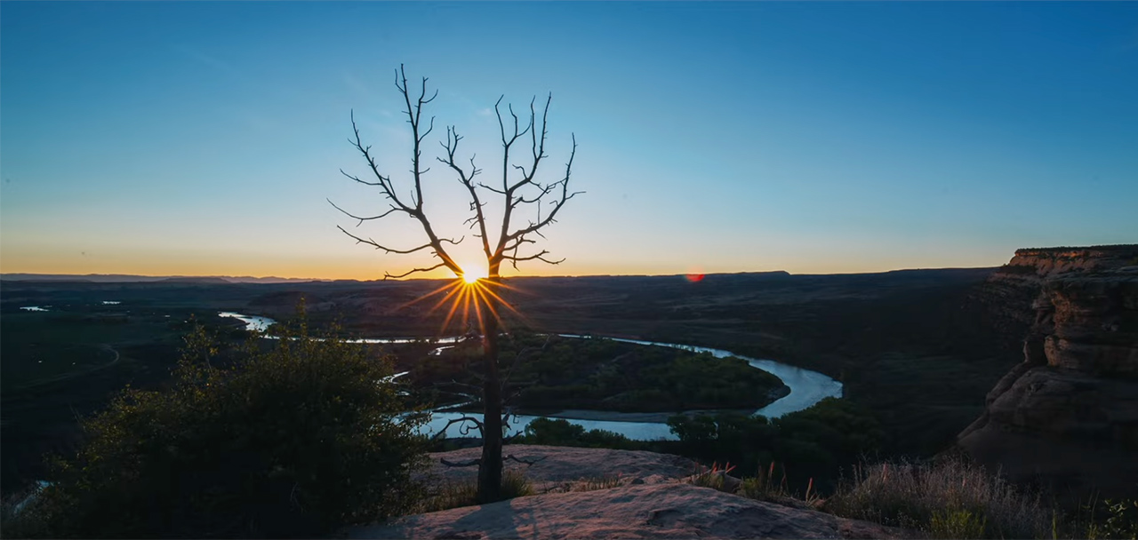 Sun emerging over Colorado River bend